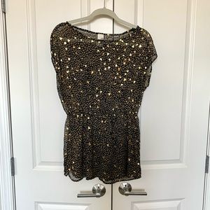 Francesca’s sheer black, taupe, and gold shirt